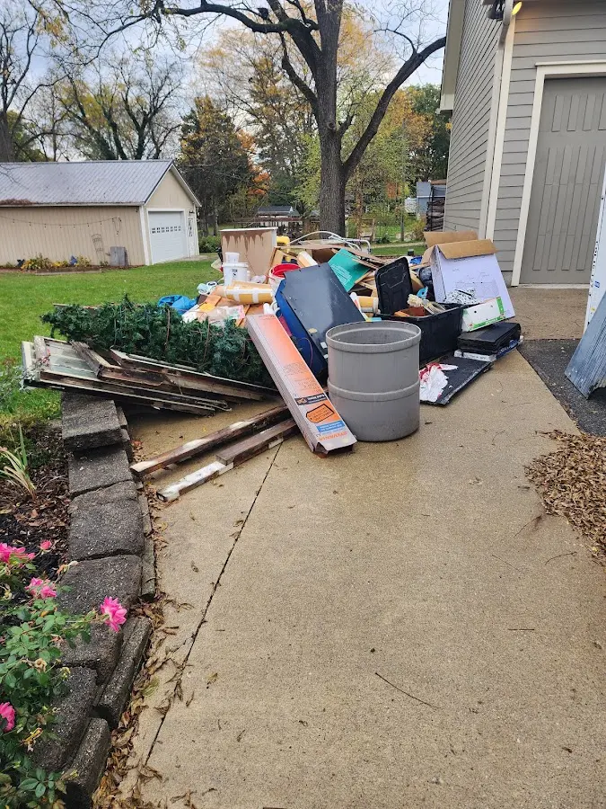 Dumpster being loaded with debris for 3 Yard Dumpster Rental in Van Buren